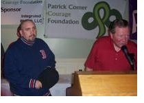 Jim Comer presents a grant to Michael Briggs